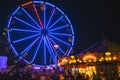 County Fair at night Ferris Wheel on the Midway Royalty Free Stock Photo