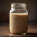 Close-up of Active, Bubbling Sourdough Starter in a Glass Mason Jar Royalty Free Stock Photo