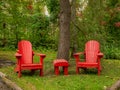 Couple of adirondack chairs in a quiet peaceful location