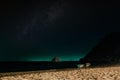 A couple admires the night starry sky in sun loungers on the beach. A quiet tropical night on the Paradise island of Koh Royalty Free Stock Photo