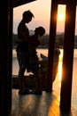 Couple admiring the sunset in Kanchanaburi, Thailand