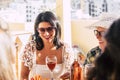 Couple of adult cheerful happy woman enjoying together lunch time outdoor at the restaurant - middle age and senior ladies smile Royalty Free Stock Photo