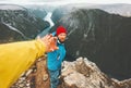 Couple adventurers in mountains follow helping hand traveling together Royalty Free Stock Photo