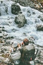 Couple adventurers relaxing at mountain river together