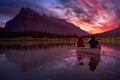 Couple adventurous friends are canoeing in a lake