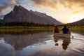 Couple adventurous friends are canoeing in a lake Royalty Free Stock Photo