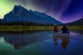Couple adventurous friends are canoeing in a lake Royalty Free Stock Photo