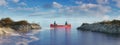 Couple adventurous people on red canoe paddling in calm water.