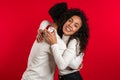 Couple of African man makes marriage proposal to lover woman with ring on red Royalty Free Stock Photo