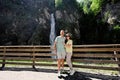 Couple against waterfall in Liechtensteinklamm or Liechtenstein Gorge, Austria