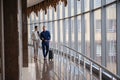 Couple at the bright airport waiting aircraft Royalty Free Stock Photo