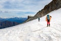 Couple alpinists mountaineers walking glacier slopes. Mont Blanc