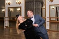 Man and woman amateur dancers laugh during classical dance with each other Royalty Free Stock Photo