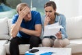 Couple analyzing family bills