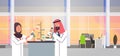 Couple arabian scientists working with microscope laboratory doing research arab man woman making scientific experiments