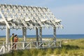 Couple on Arbor Looking at Sea