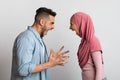 Couple Arguing. Furious Muslim Couple Shouting At Each Other, Having Relationship Problems Royalty Free Stock Photo