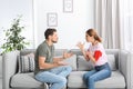 Couple arguing in living room. Royalty Free Stock Photo