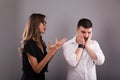 Couple arguing. Young woman speaking emotionally, blaming man, gesturing, explaining opinion. Unhappy girlfriend shouting to frust