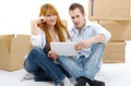 Couple arranging new apartment with digital tablet Royalty Free Stock Photo