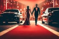Couple arriving with limousine walking red carpet, Woman in a luxurious dress on a red carpet. Blurred image Royalty Free Stock Photo