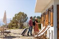 Couple arriving to at holiday home Royalty Free Stock Photo