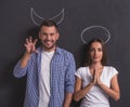 Couple as angel and demon Royalty Free Stock Photo