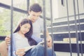 Couple asian handsome man and beautiful woman reading book and smile Royalty Free Stock Photo