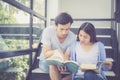 Couple asian handsome man and beautiful woman reading book and smile Royalty Free Stock Photo