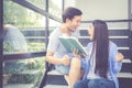 Couple asian handsome man and beautiful woman reading book and glad at home Royalty Free Stock Photo