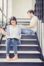 Couple asian handsome man and beautiful woman reading book and smile at home, boyfriend and girlfriend with activities together Royalty Free Stock Photo