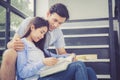 Couple asian handsome man and beautiful woman reading book and smile Royalty Free Stock Photo