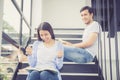 Couple asian handsome man and beautiful woman reading book and smile at home, boyfriend and girlfriend with activities together Royalty Free Stock Photo