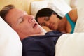 Couple Asleep In Bed With Man Snoring Royalty Free Stock Photo