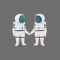 Couple of astronauts standing holding hands isolated on a gray background. Love, romance, relationship, friendship. Cartoon Royalty Free Stock Photo