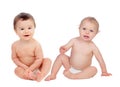 Couple of babies sitting on the floor Royalty Free Stock Photo