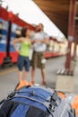 A couple of backpacker tourists waiting to board a train Royalty Free Stock Photo