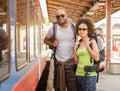 A couple of backpacker tourists waiting to board a train Royalty Free Stock Photo