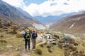 Couple backpackers hiking mountain trail in Nepal. Royalty Free Stock Photo