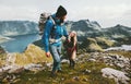 Couple backpackers hiking in Norway mountains