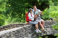 Couple of backpackers reading map in natural ambient Royalty Free Stock Photo