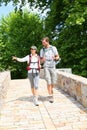 Couple of backpackers walking in peaceful place Royalty Free Stock Photo
