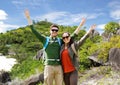 Couple with backpacks traveling around island Royalty Free Stock Photo