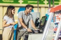 Couple with bank card buying food at grocery store or supermarket self-checkout Royalty Free Stock Photo