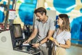 Couple with bank card buying food at grocery store or supermarket self-checkout Royalty Free Stock Photo