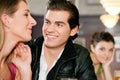 Couple in bar drinking beer flirting Royalty Free Stock Photo