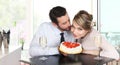 Couple at the bar with sparkling wine and cake, love conce