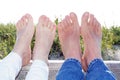 Couple at the Beach with feet in the summer sunlight Royalty Free Stock Photo