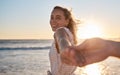 Couple at beach, holding hands and love at sunset, travel together and adventure with romantic vacation portrait Royalty Free Stock Photo