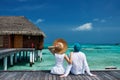 Couple on a beach jetty at Maldives Royalty Free Stock Photo